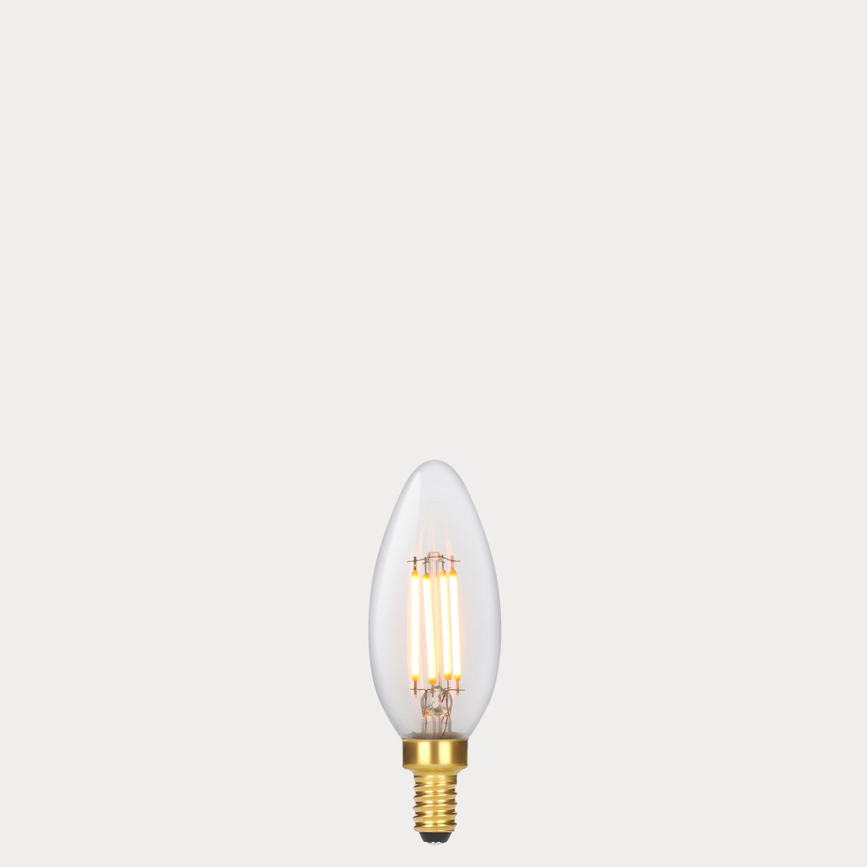 Dulora 4W Candle LED Bulb E12 Clear in Extra Warm filaments glowing