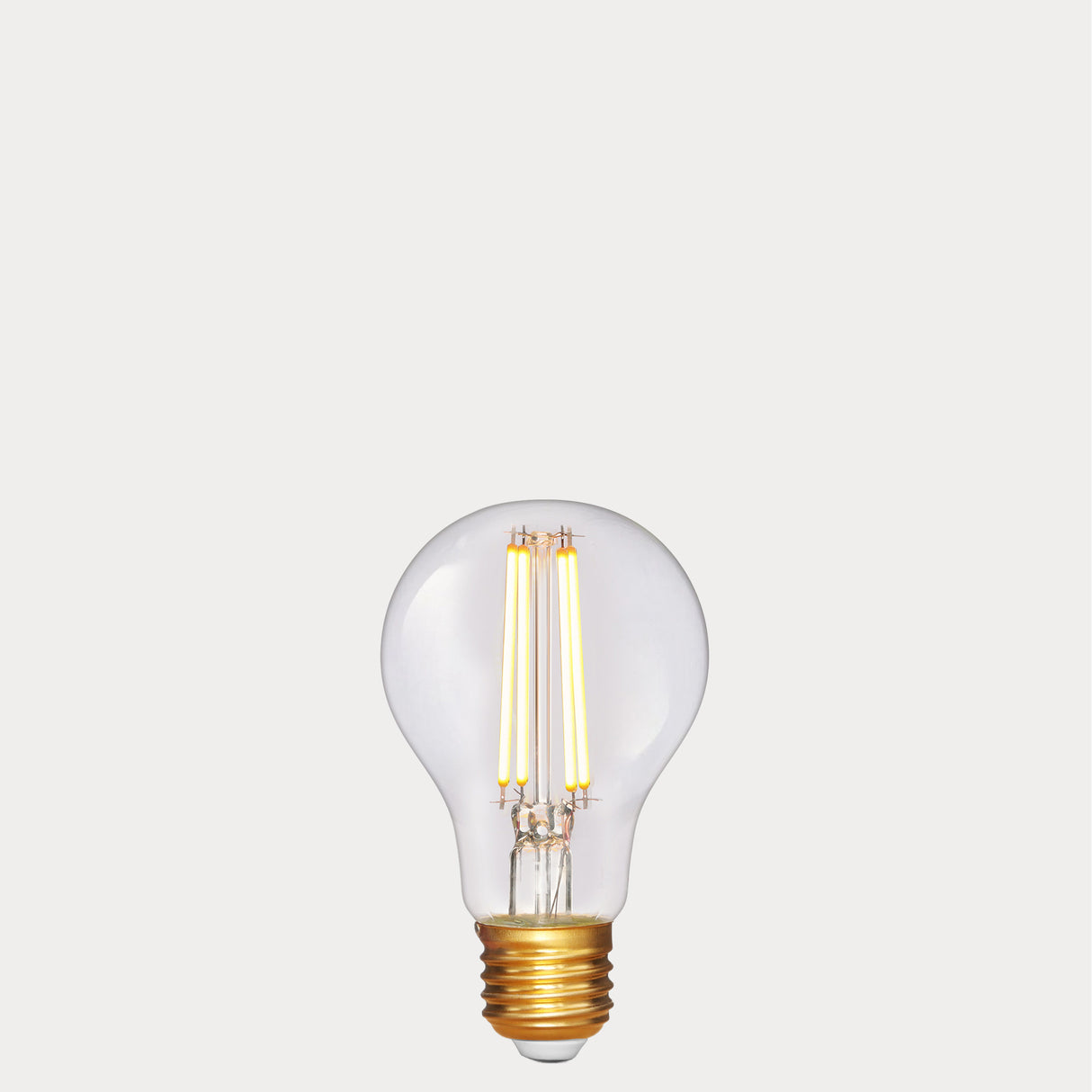 Dulora 6.5W GLS LED Bulb E27 in Extra Warm White filaments glowing extra warm white gold base