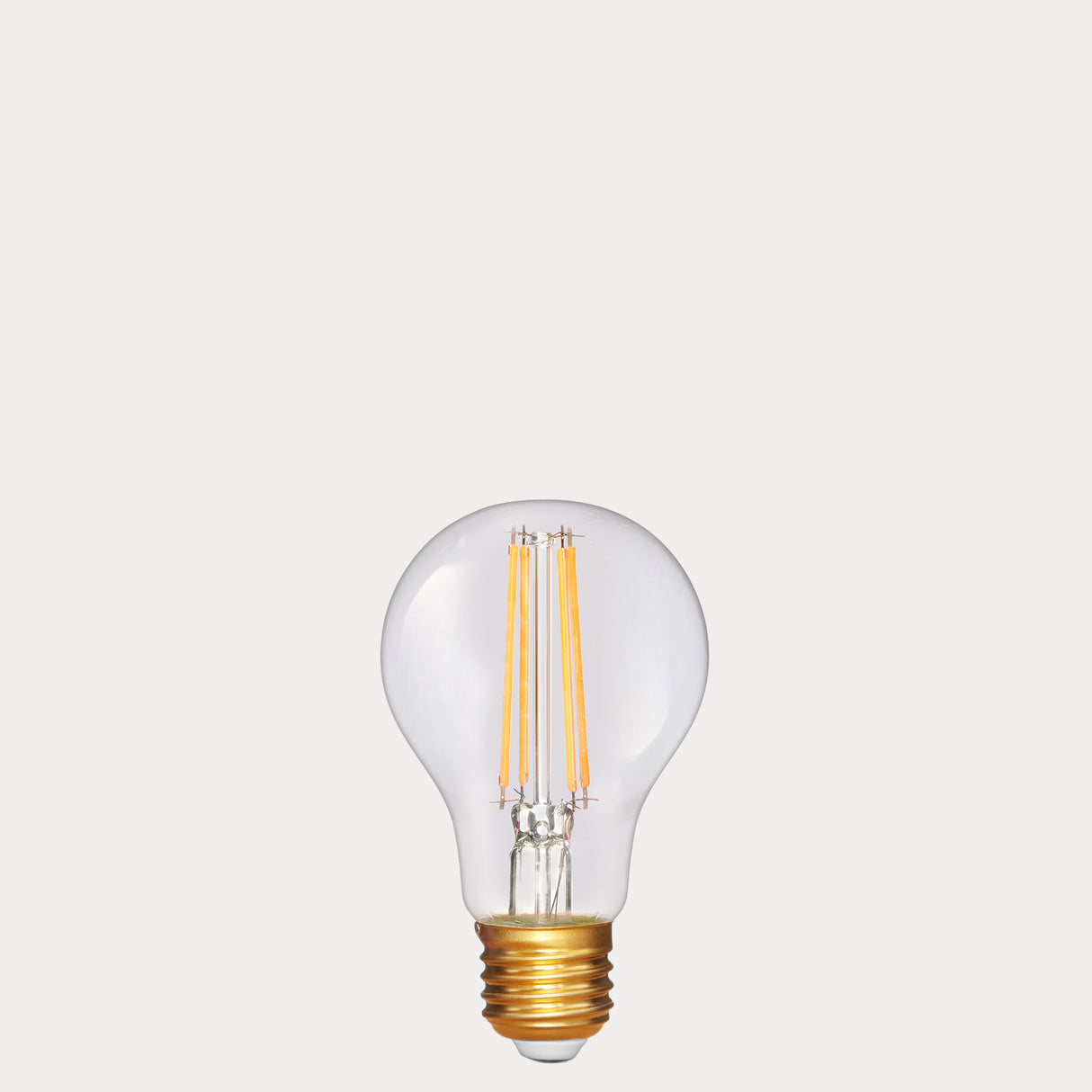 Dulora 6.5W GLS LED Bulb E27 in Extra Warm White clear glass with visible filaments unlit gold base