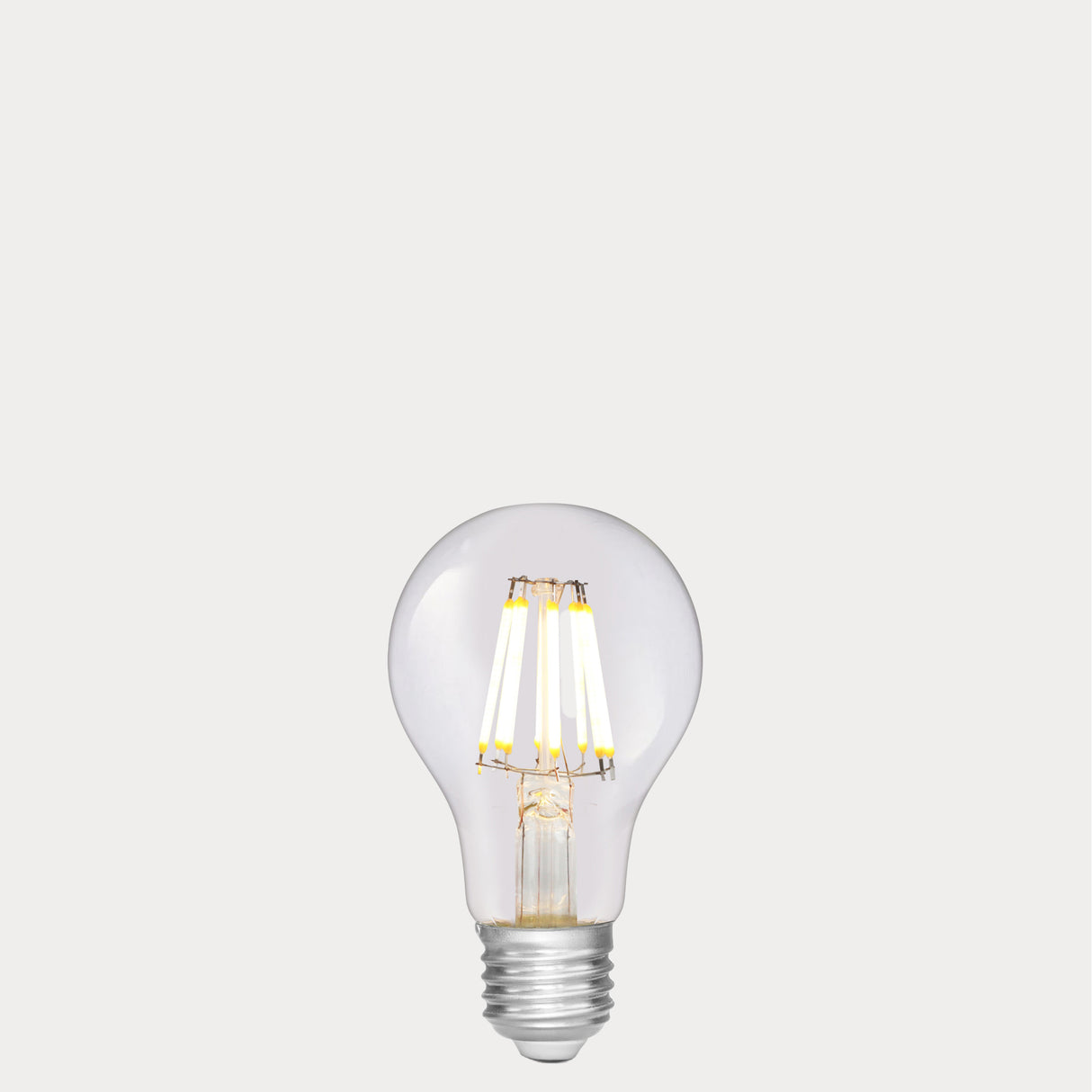 Dulora 8W 12-24 Volt AC/DC GLS LED Bulb E27 Clear in Warm White illuminated with warm glow through clear A60 glass