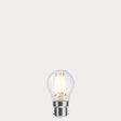 Dulora 4W Fancy Round LED Bulb B22 Clear in Warm White filaments glowing warm white 2700K