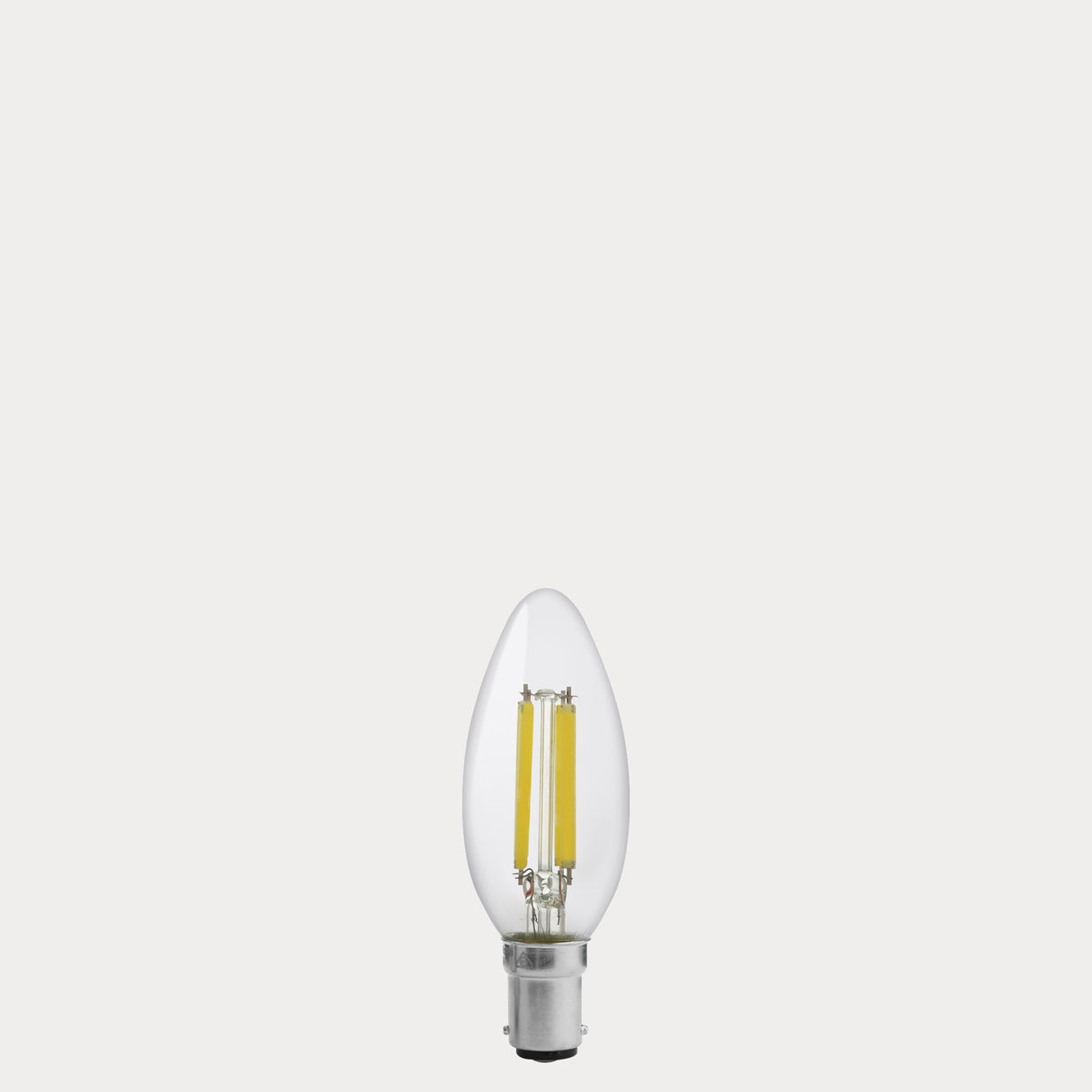 Dulora 5.5W Candle LED Bulb B15 Clear in Natural White unlit with visible filaments