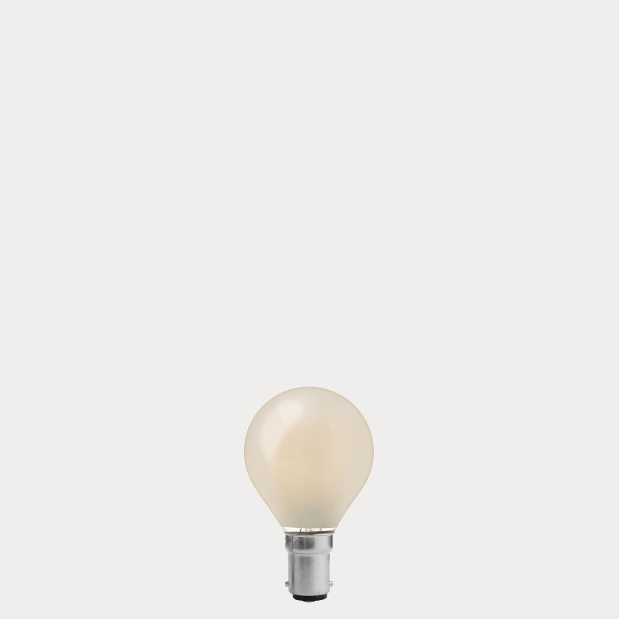 Dulora 5.5W Fancy Round LED Bulb B15 Frost in Warm White unlit showing matte diffused glass