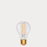 Dulora 6.5W GLS LED Bulb E27 in Extra Warm White clear glass with visible filaments unlit gold base